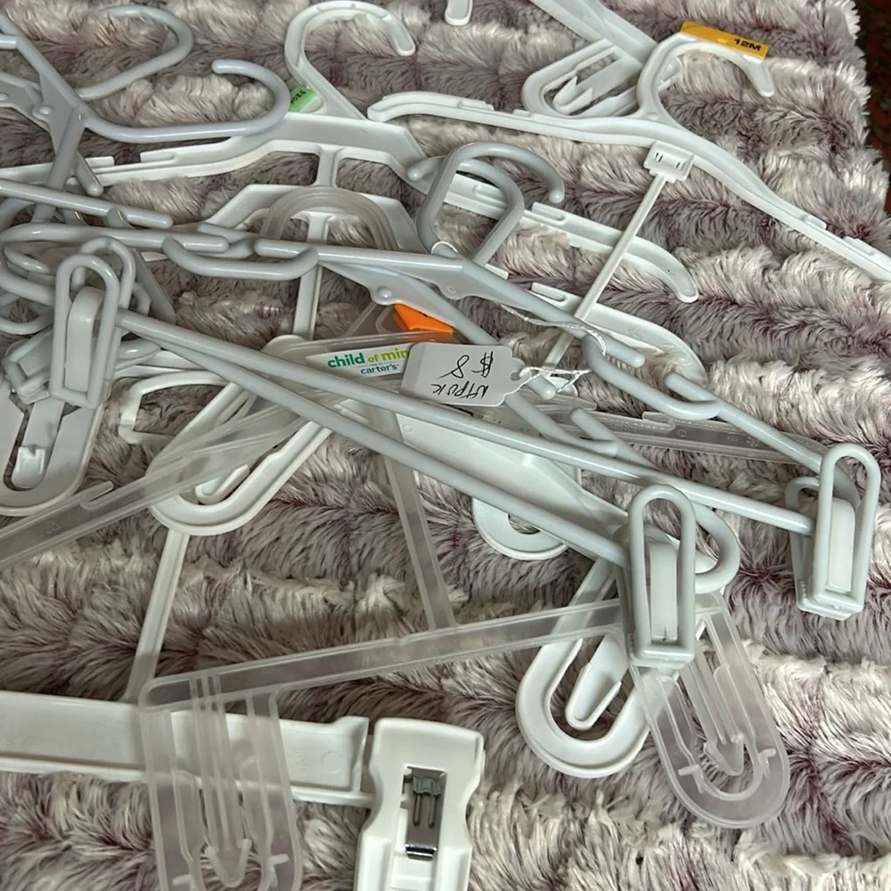 28 kids plastic hangers All white , all different